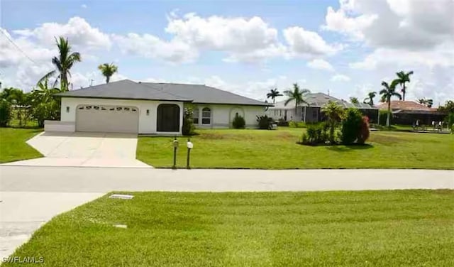 single story home with a front yard and a garage