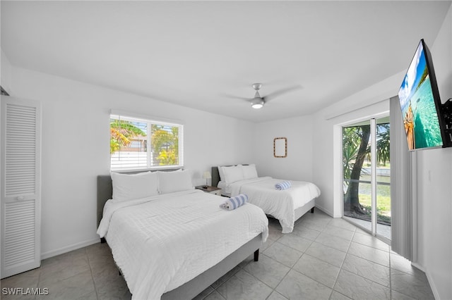 bedroom with baseboards, light tile patterned floors, access to outside, and ceiling fan