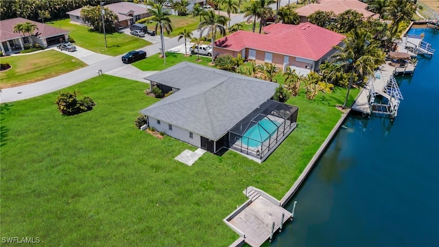 aerial view with a residential view and a water view