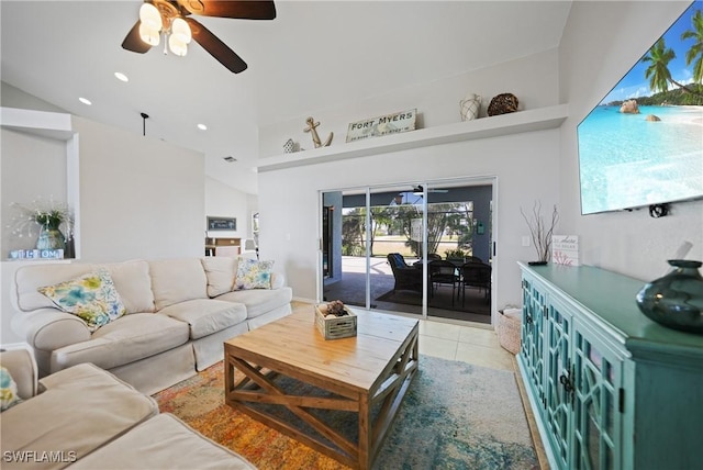 tiled living room featuring ceiling fan and lofted ceiling