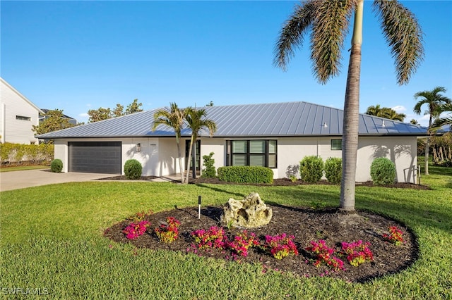 single story home featuring a garage and a front lawn