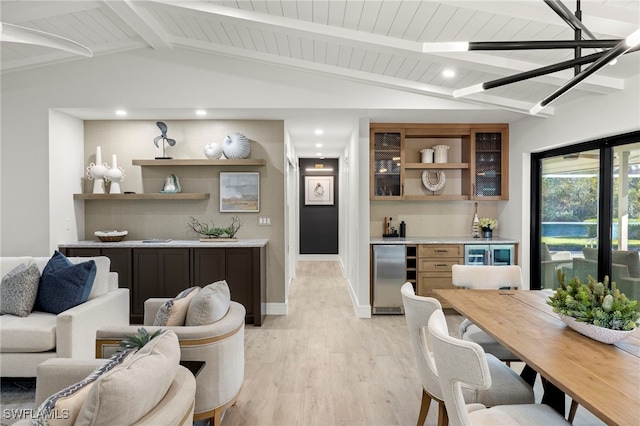 living room with vaulted ceiling with beams, light hardwood / wood-style floors, wooden ceiling, and bar