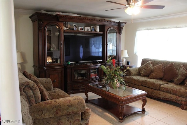 tiled living room featuring ceiling fan and crown molding