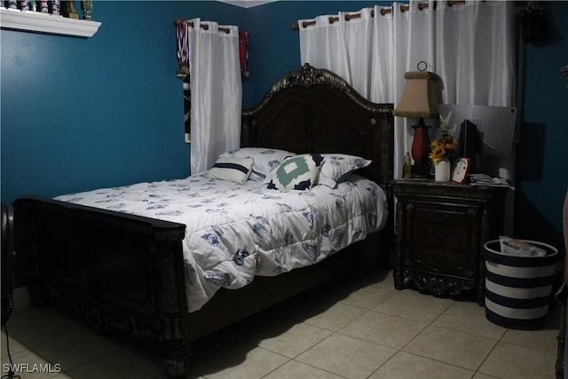 bedroom featuring light tile patterned floors