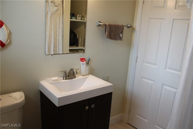 bathroom with vanity and toilet