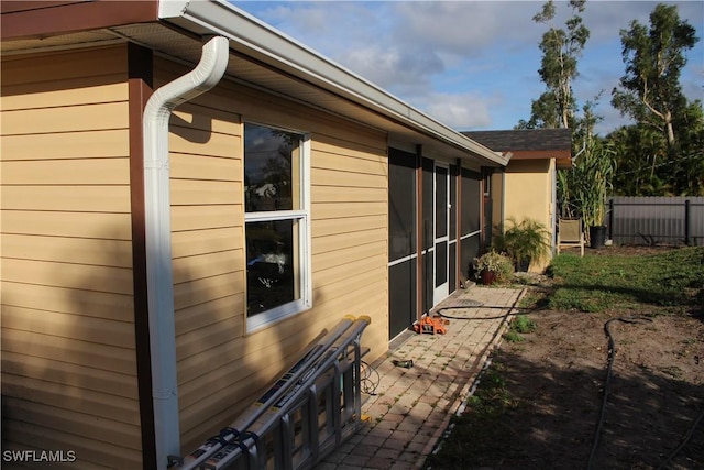 view of side of home with a patio