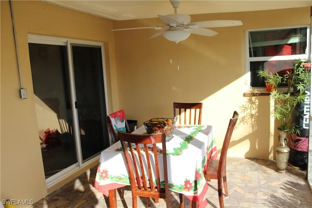 exterior space featuring ceiling fan