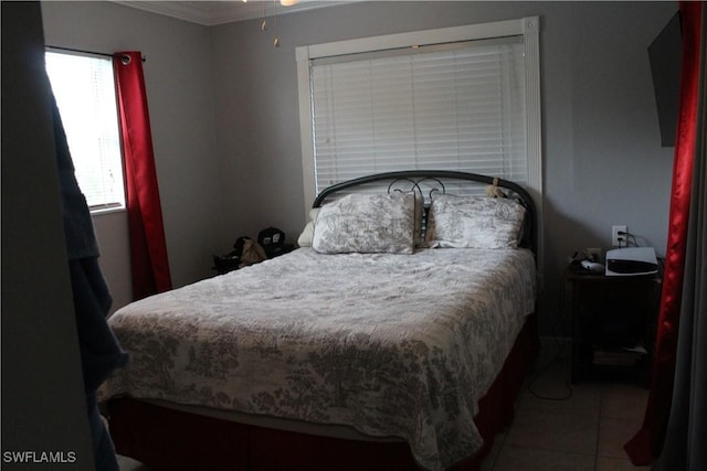 tiled bedroom with ornamental molding