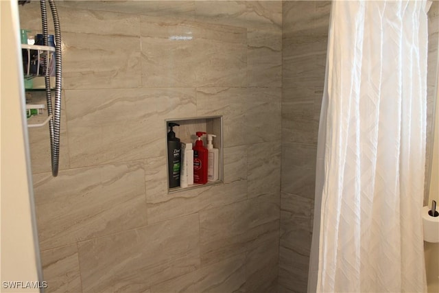 bathroom featuring curtained shower