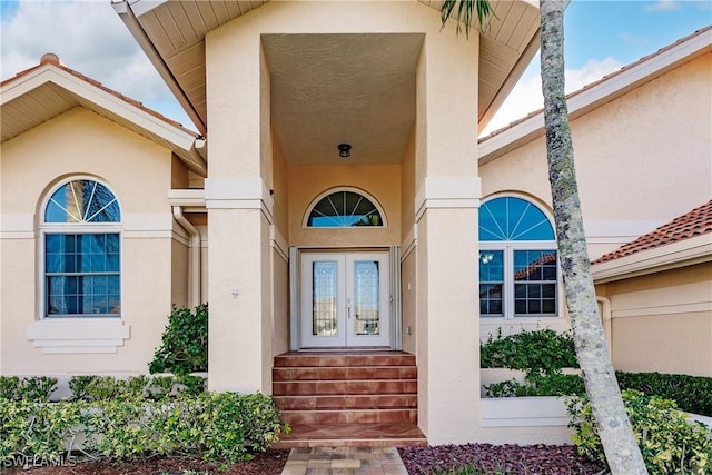 5471 Harborage Dr, Fort Myers, FL 33908 - doorway to property with french doors and stucco siding