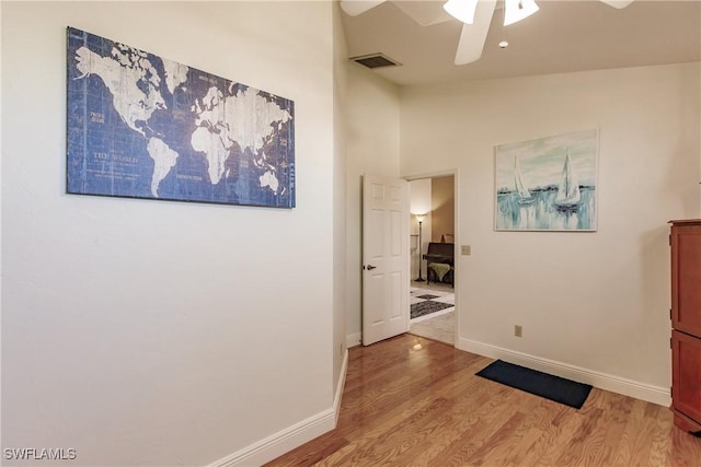 5471 Harborage Dr, Fort Myers, FL 33908 - hall featuring visible vents, light wood-style floors, baseboards, and lofted ceiling