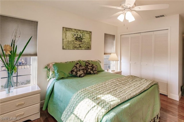 bedroom featuring hardwood / wood-style floors, a closet, and ceiling fan