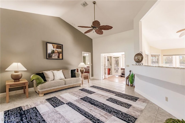 5471 Harborage Dr, Fort Myers, FL 33908 - tiled living room with visible vents, baseboards, high vaulted ceiling, and ceiling fan