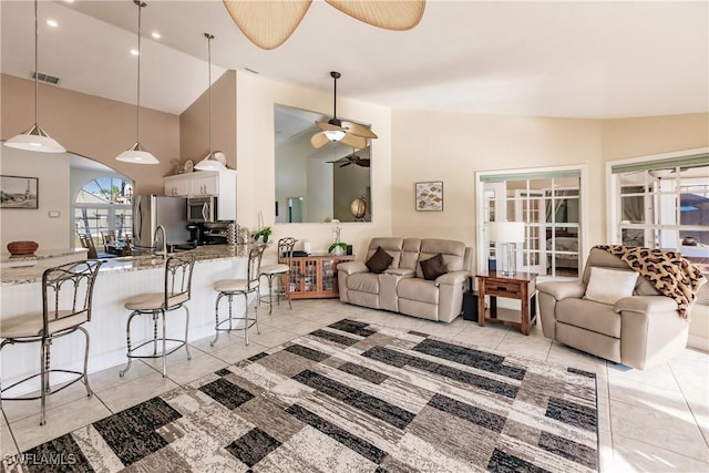 5471 Harborage Dr, Fort Myers, FL 33908 - living room with visible vents, ceiling fan, vaulted ceiling, recessed lighting, and light tile patterned flooring