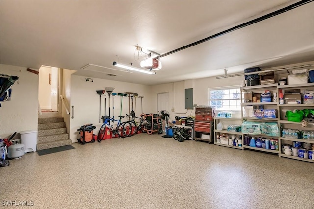 garage featuring a garage door opener and electric panel