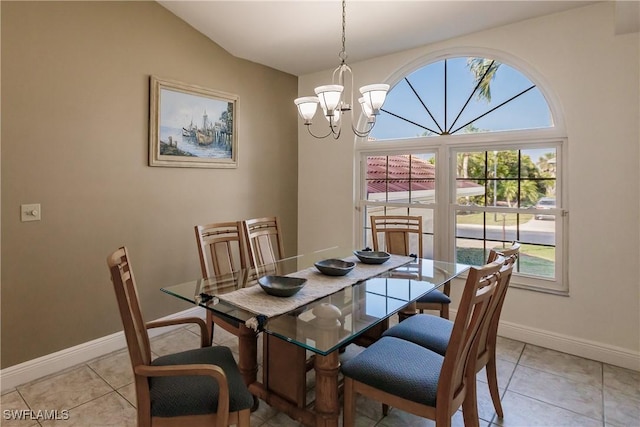 tiled dining area featuring a notable chandelier