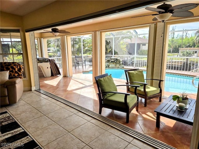 5471 Harborage Dr, Fort Myers, FL 33908 - sunroom featuring plenty of natural light, ceiling fan, and tile patterned flooring