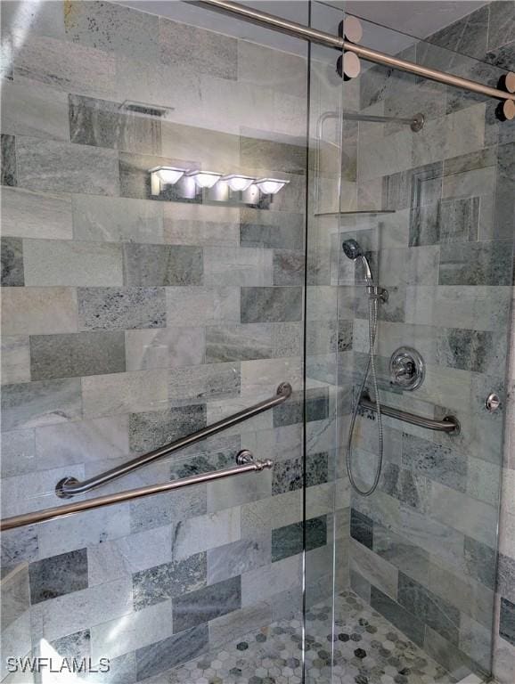 bathroom with a shower stall