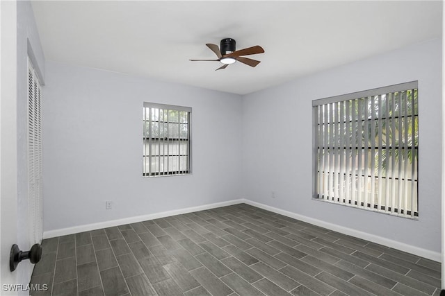 unfurnished bedroom with ceiling fan and dark hardwood / wood-style flooring