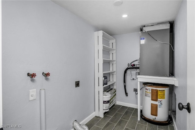 utility room featuring water heater