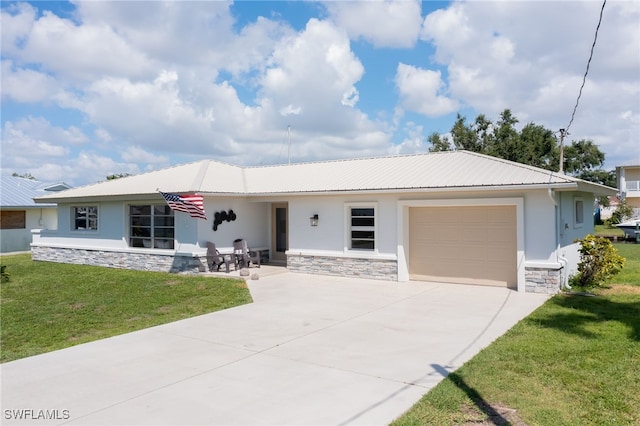 single story home featuring a garage and a front lawn