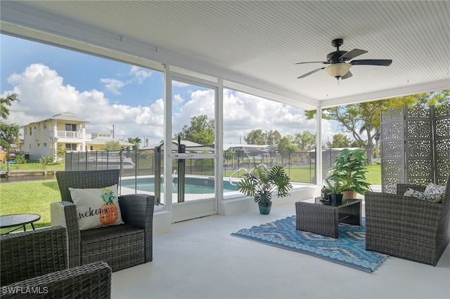 sunroom with ceiling fan