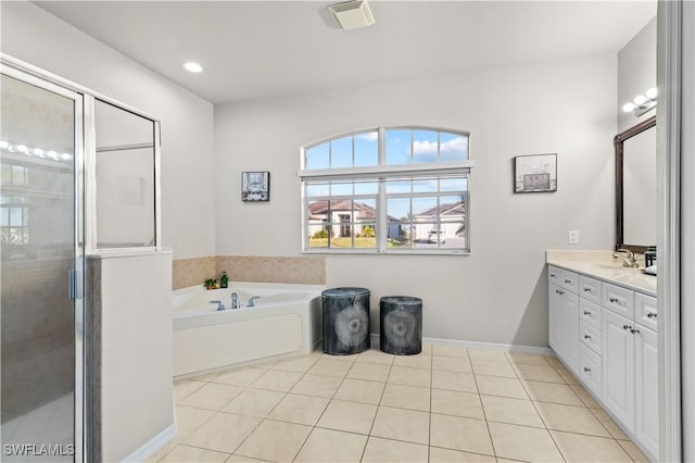 bathroom featuring tile patterned flooring, vanity, and independent shower and bath