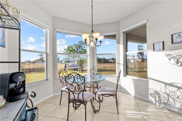 sunroom featuring a chandelier