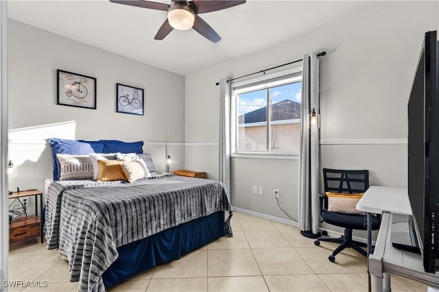 tiled bedroom featuring ceiling fan