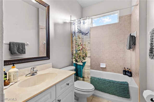 full bathroom featuring tile patterned floors, vanity, shower / bath combination with curtain, and toilet