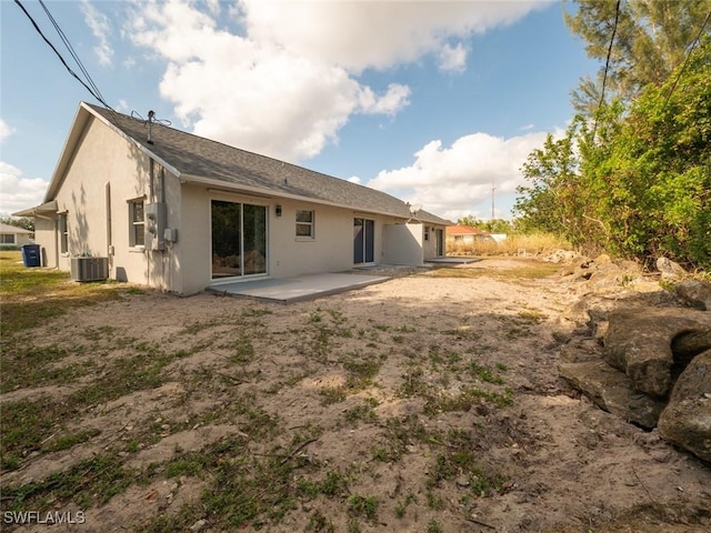 back of property featuring a patio and central AC unit