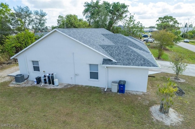 view of home's exterior with a lawn