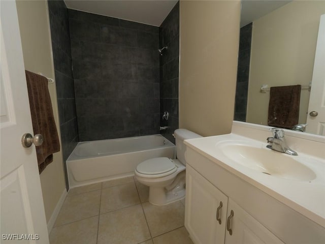 full bathroom featuring tile patterned floors, tiled shower / bath combo, toilet, and vanity