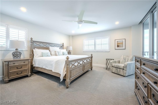 bedroom featuring ceiling fan and light colored carpet