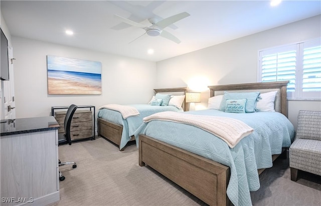 bedroom featuring ceiling fan and light colored carpet