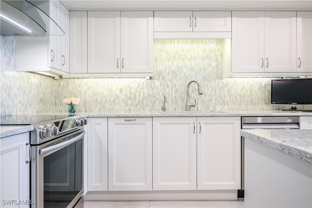 kitchen with ventilation hood, white cabinetry, and stainless steel electric range oven