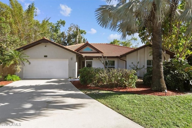 view of front facade with a garage and a front lawn