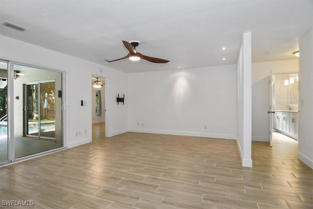 unfurnished room with ceiling fan