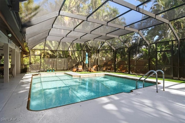 view of swimming pool with a patio and glass enclosure