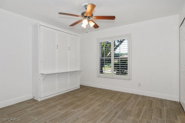 unfurnished room with ceiling fan and light hardwood / wood-style floors