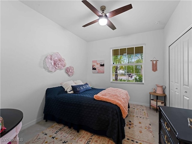 bedroom with ceiling fan and a closet