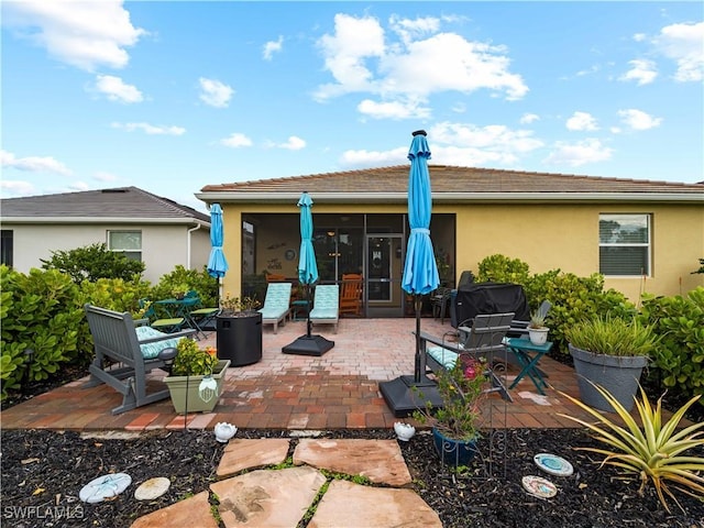 rear view of house with a patio