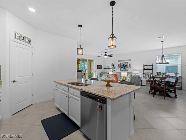 kitchen featuring ceiling fan with notable chandelier, a kitchen island with sink, sink, dishwasher, and white cabinetry