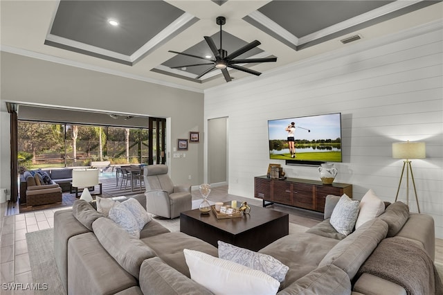 living room featuring beam ceiling, wood walls, coffered ceiling, and ornamental molding