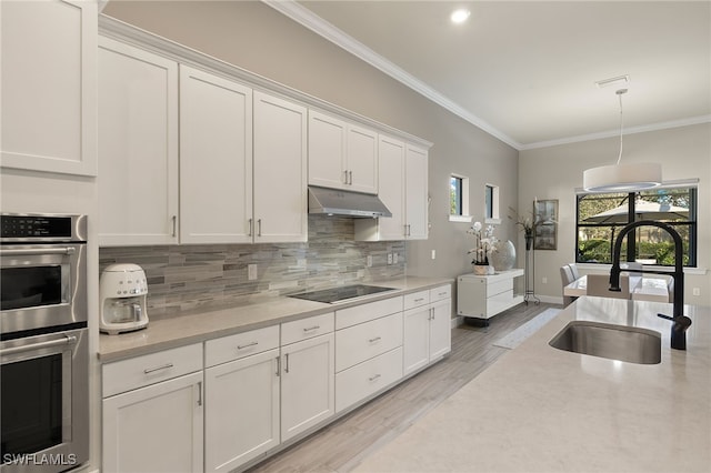 kitchen featuring white cabinetry, stainless steel double oven, sink, and black electric cooktop