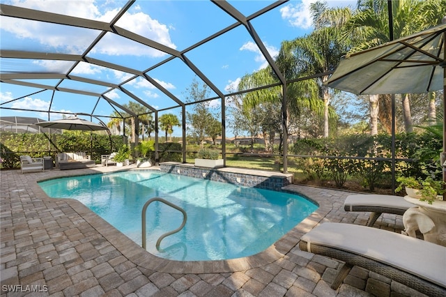 view of swimming pool with pool water feature, a lanai, and a patio