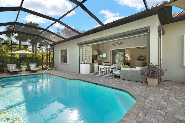 view of swimming pool featuring an outdoor living space, a patio, glass enclosure, and area for grilling