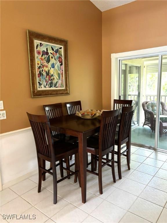 dining area featuring light tile patterned floors