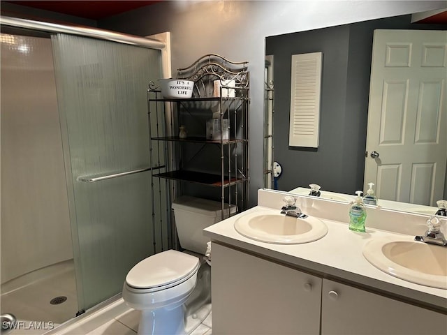 bathroom featuring vanity, toilet, and walk in shower