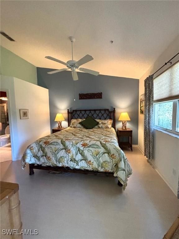 bedroom featuring ceiling fan and vaulted ceiling